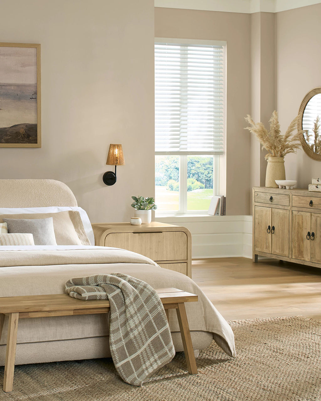 Neatly arranged bedroom with a bed, bench, and dresser.
