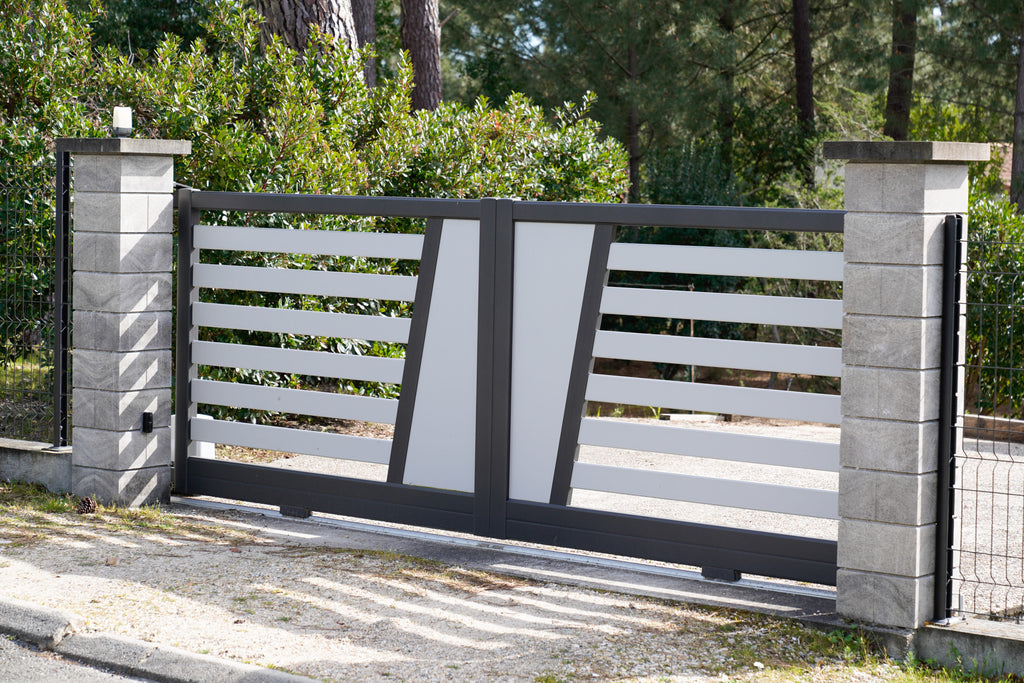 Modern gate with concrete pillars in a residential area