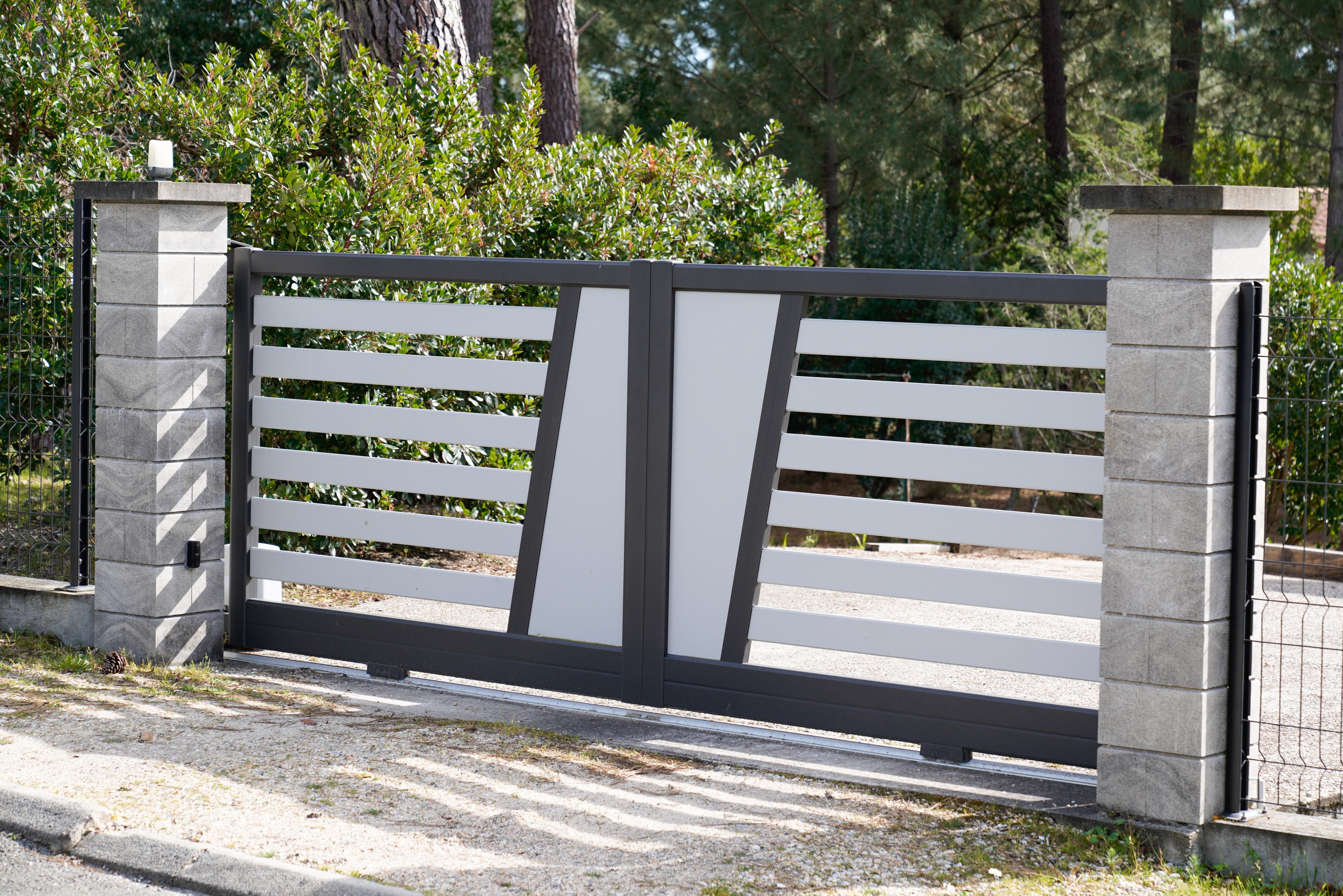 Modern gate with concrete pillars in a residential area