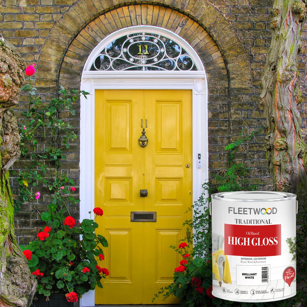 Yellow door with decorative archway and 'Fleetwood' paint can in the foreground