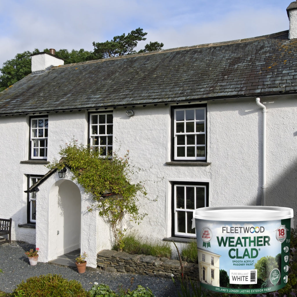White house with a can of Fleetwood Weather Clad paint in front