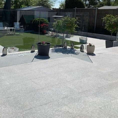 Durero Grey Granite Effect Outdoor Tile in Modern Garden
